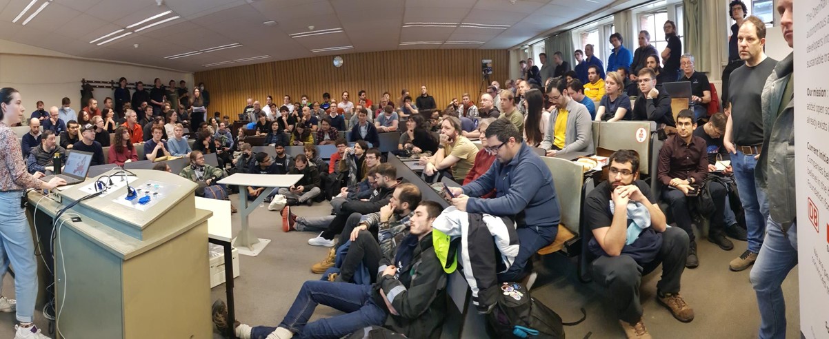 Picture of the crowded devroom in 2023