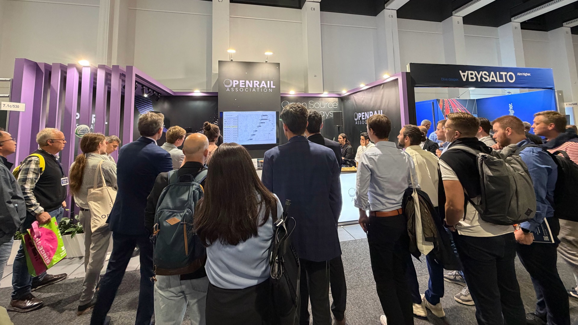 Visitors at the OpenRail Association stand at InnoTrans 2026